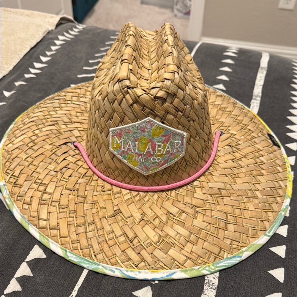 Tan and Pink Wide-Brimmed Straw Hat with Decorative Band